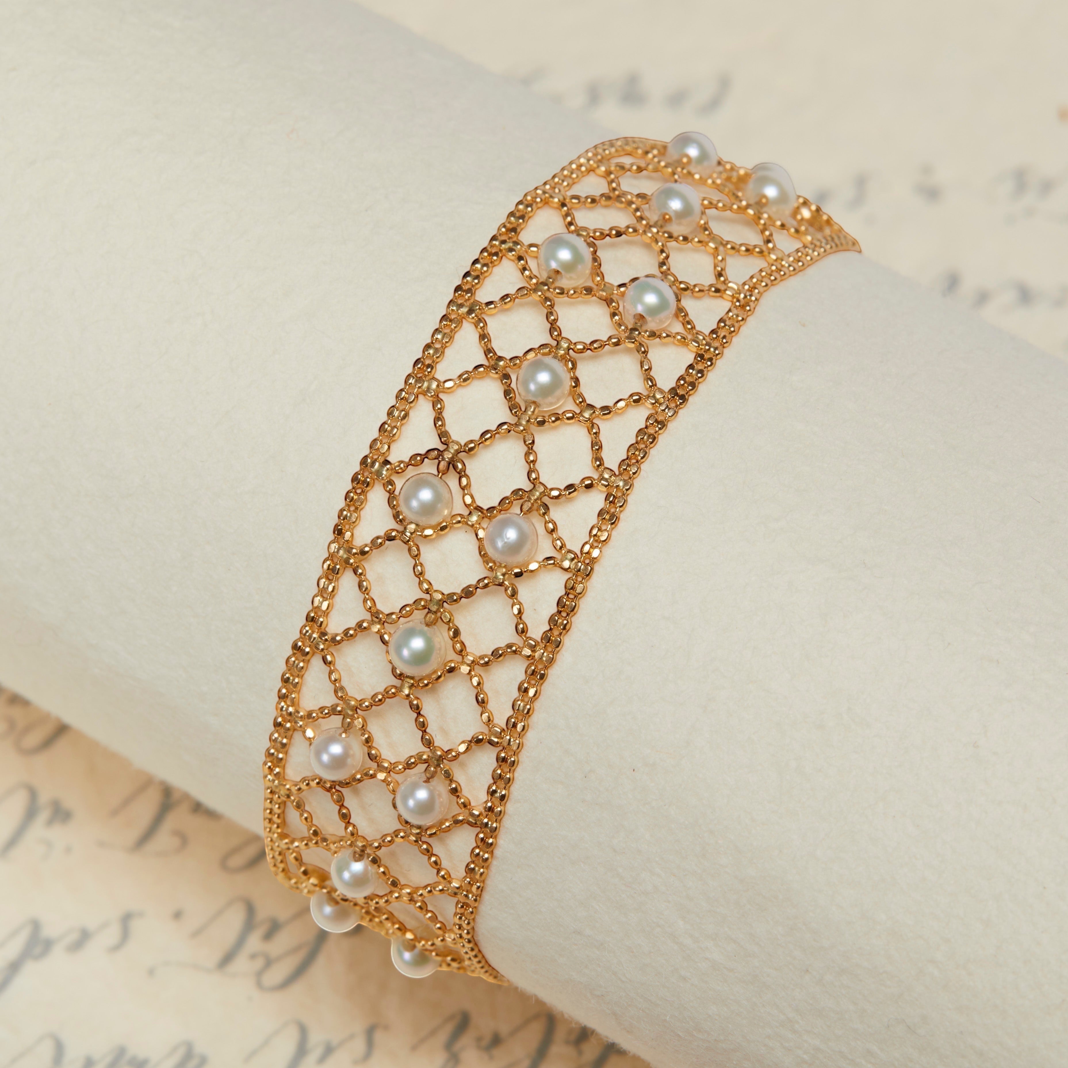 BoxUnboxed 18k yellow gold lace lattice bracelet with Akoya pearls. Flexible, woven gold mesh with 3-3.5mm pearls.