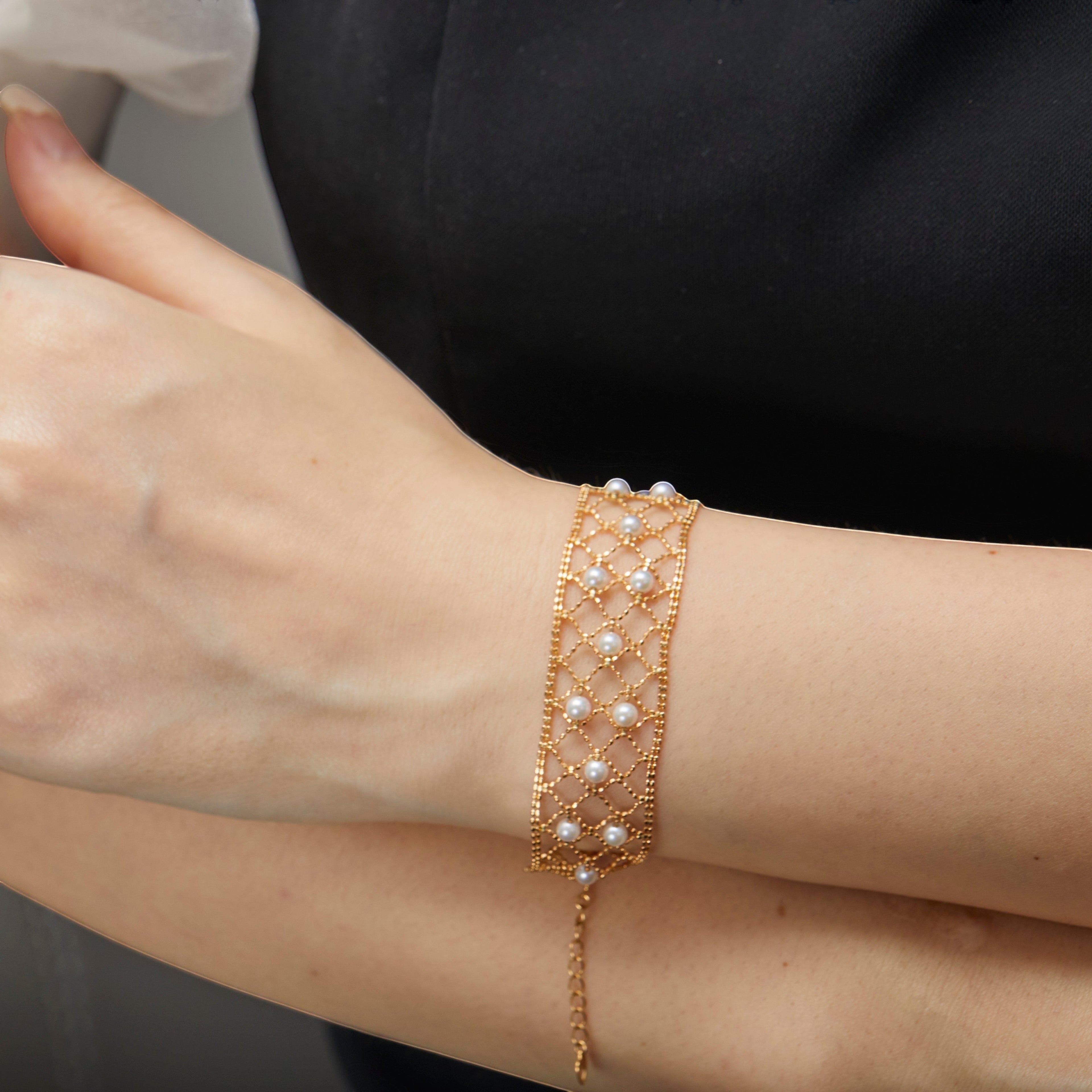 BoxUnboxed 18k yellow gold lace lattice bracelet with Akoya pearls. Adjustable length, secure clasp.
