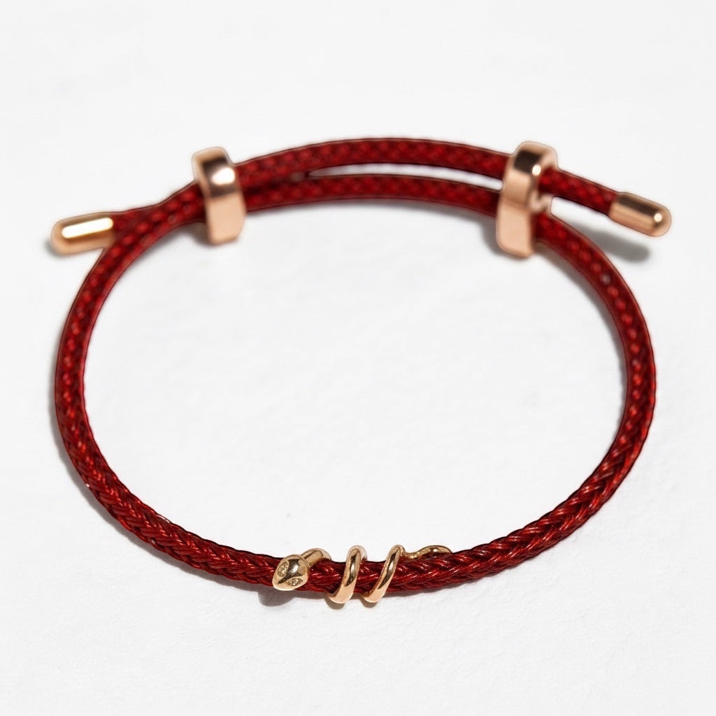 BoxUnboxed 18k solid gold snake bracelet with diamond on red string, adjustable fit.