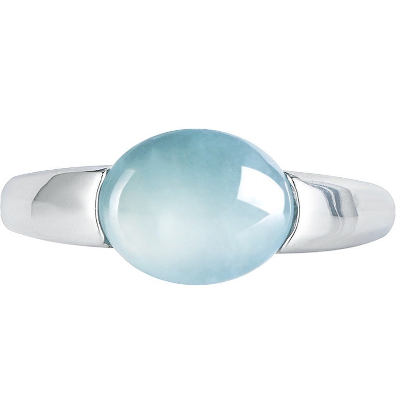 BoxUnboxed Aurora Ring: adjustable, platinum-plated sterling silver band with a smooth, icy teal-blue cabochon Grade-A jadeite stone.