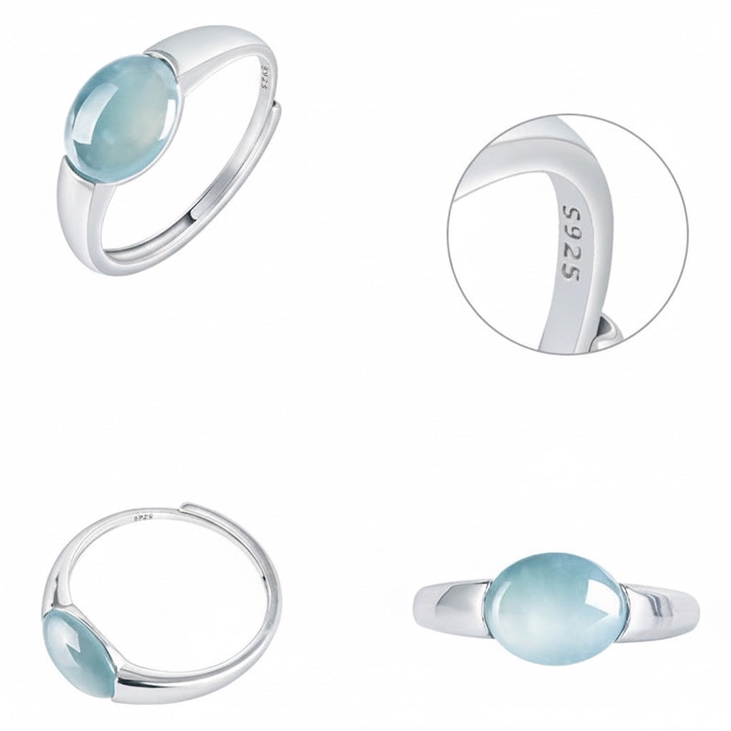BoxUnboxed Aurora adjustable ring with a smooth blue water jadeite cabochon in a platinum-plated sterling silver setting.