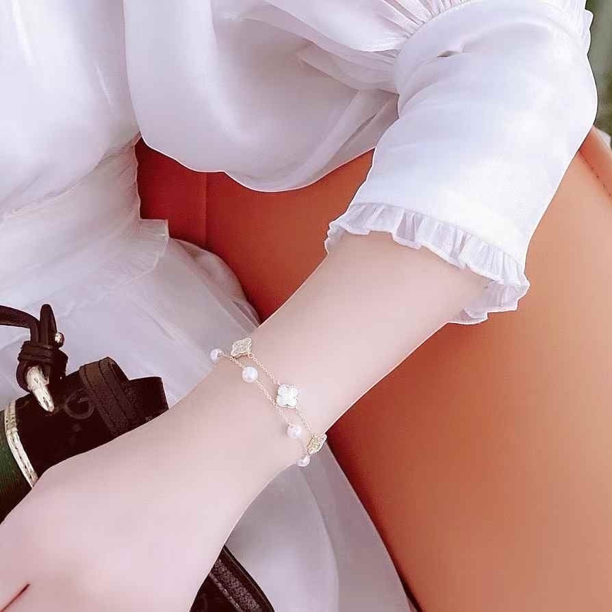 BoxUnboxed Classic Clover Double-Layer Pearl Bracelet with gold-plated finish, white freshwater pearls, and clover charms.